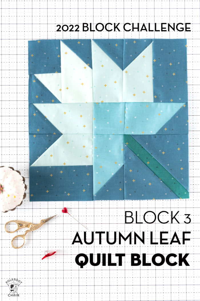 White blue and green quilt block on white cutting mat with folded fabrics