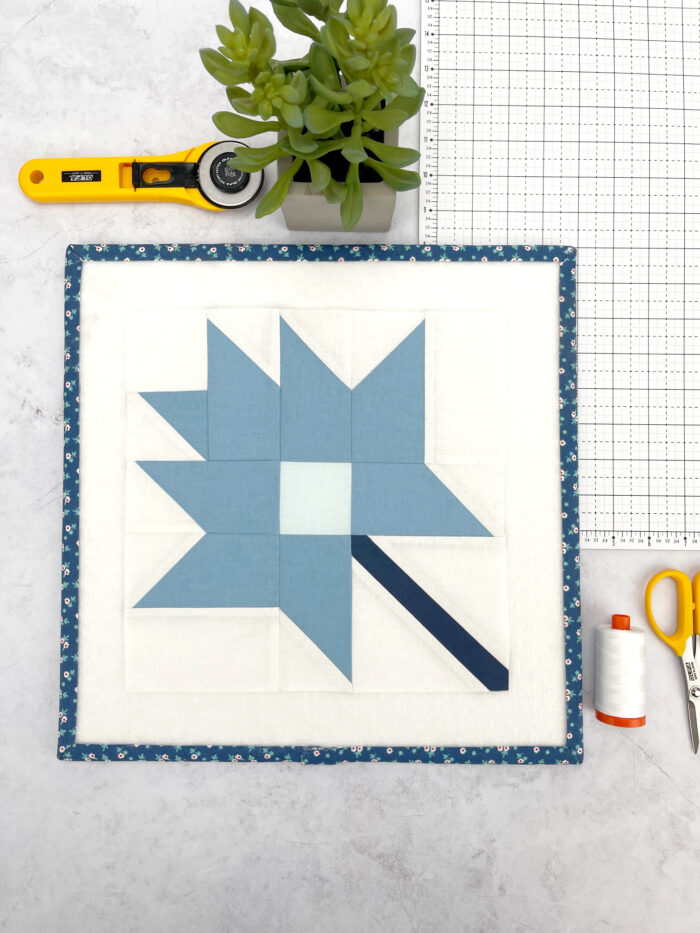 blue leaf quilt block on table
