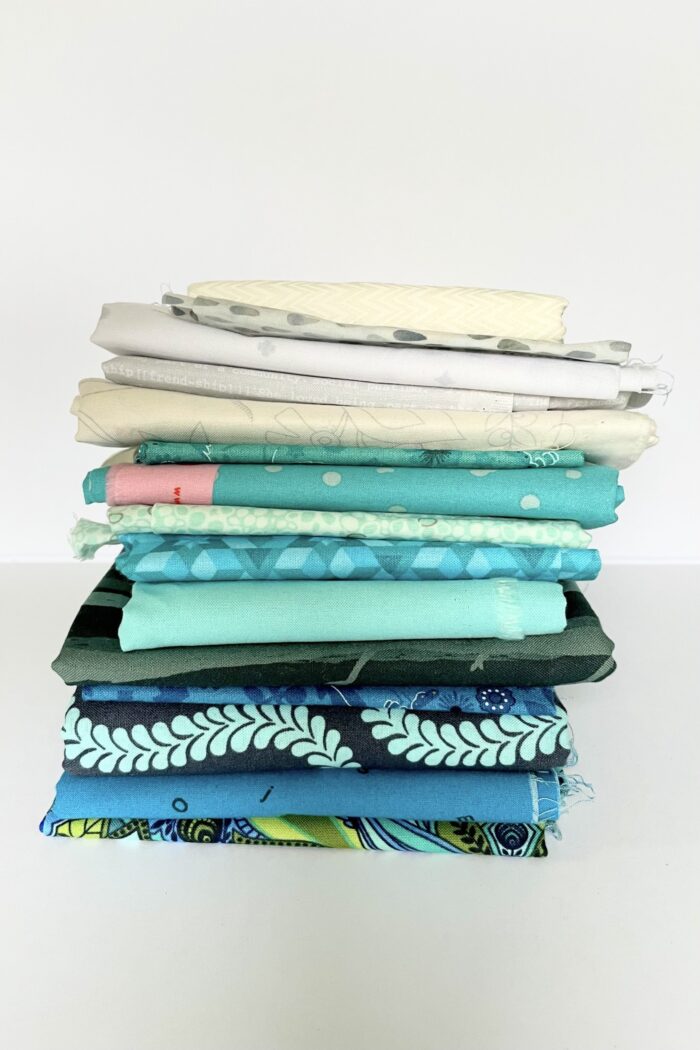 stack of blue and white fabrics