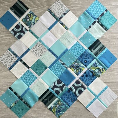 blue fabrics sewn together in patchwork pattern