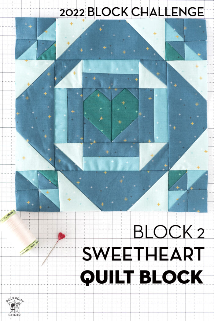 White blue and green quilt block on white cutting mat with folded fabrics