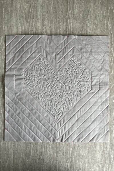 back of pillow quilted - fabric is gray