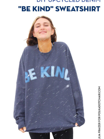 girl wearing blue sweatshirt standing in snowstorm