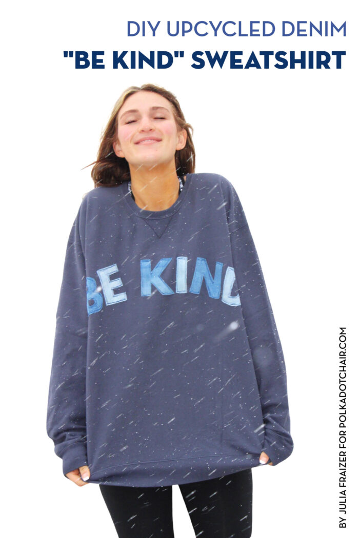 girl wearing blue sweatshirt standing in snowstorm