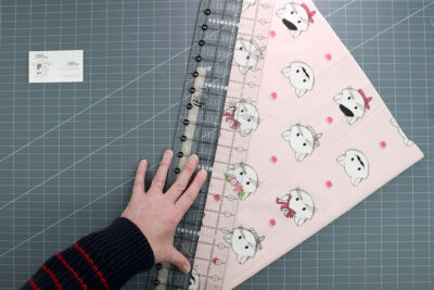 hand cutting pink fabric