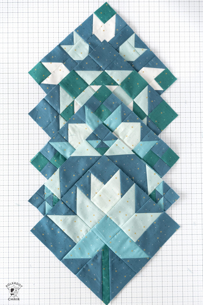 blue and white quilt block on white cutting mat