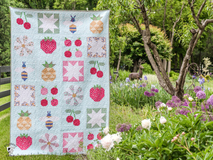 Colorful quilt with fruit quilt blocks in garden