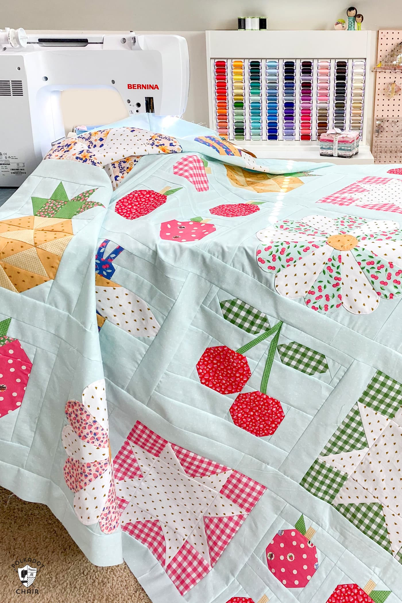 quilt top draped on sewing table