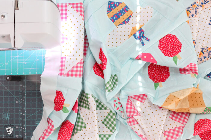 quilt under sewing machine being assembled