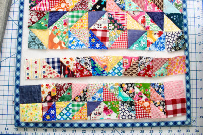 rows of patchwork squares partially sewn together