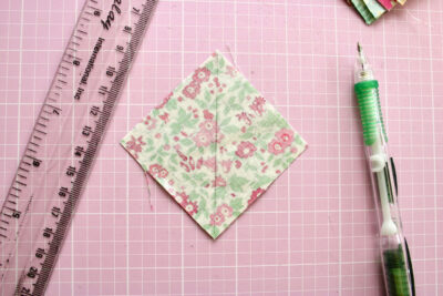 fabric and pencil on pink cutting mat