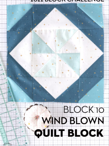 Aqua, blue and white quilt block on white cutting mat with ruler