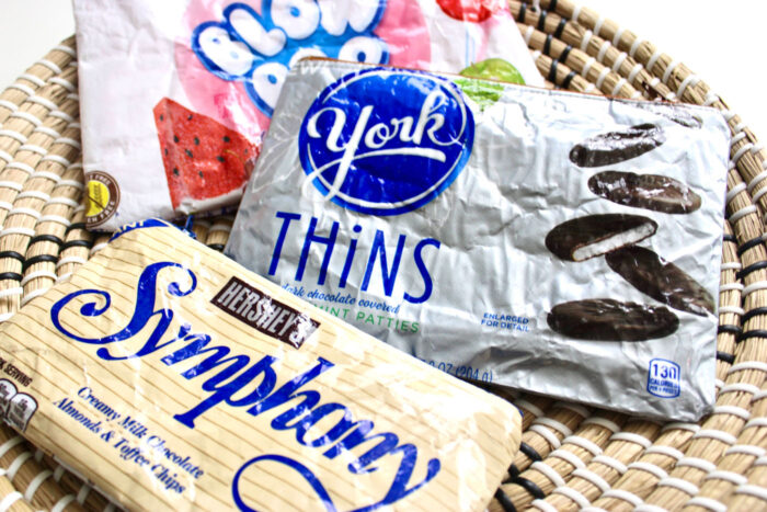 Zip bags made from candy bags in straw bowl on table