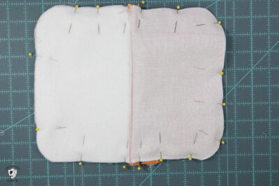 two pieces of fabric pinned around perimeter