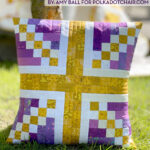 purple and gold union jack patchwork pillow outside