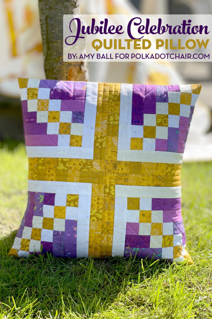 purple and gold union jack patchwork pillow outside