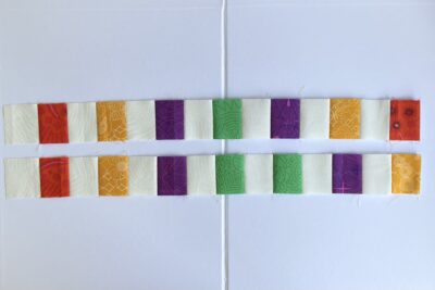 squares of yellow, purple, green and red fabric