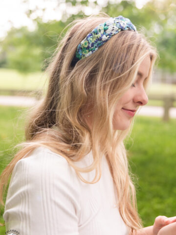 profile view of girl wearing headband outdoors