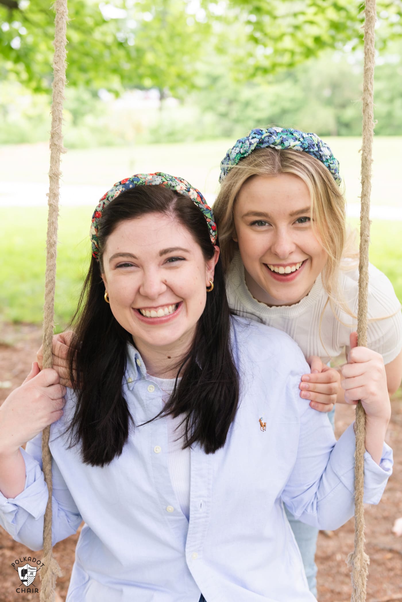 two girls wearing headbands outdoors