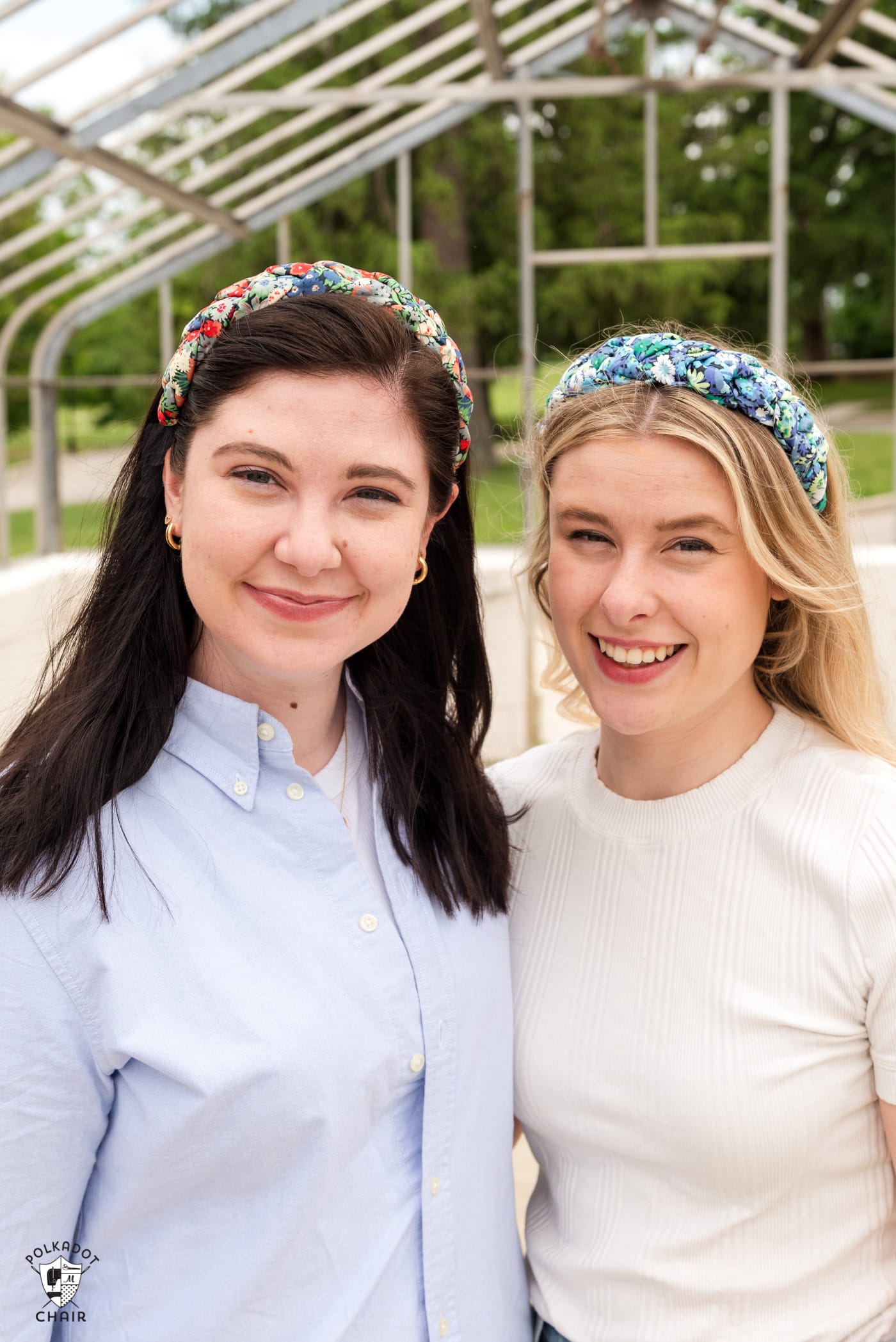 two girls wearing headbands outdoors