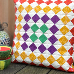 colorful quilted pillow on deck outdoors