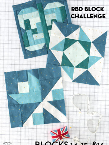 3 aqua, blue and green quilt block on white cutting mat with notions