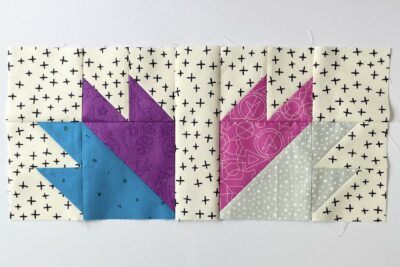 quilt block made from blue, purple, pink and gray fabric