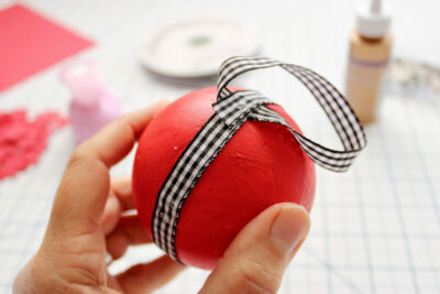 black and white ribbon on red ball