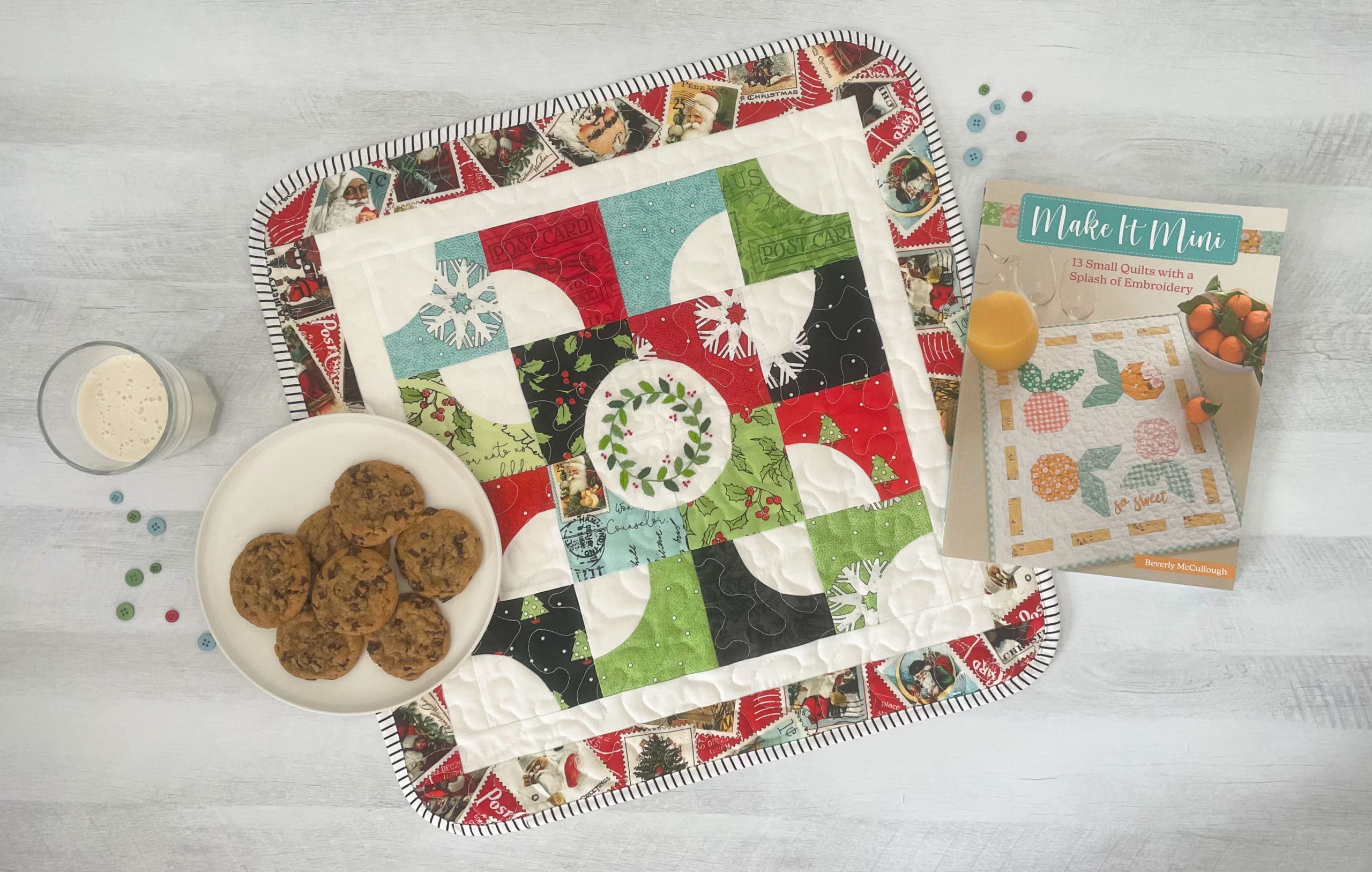 christmas mini quilt with cookies on table