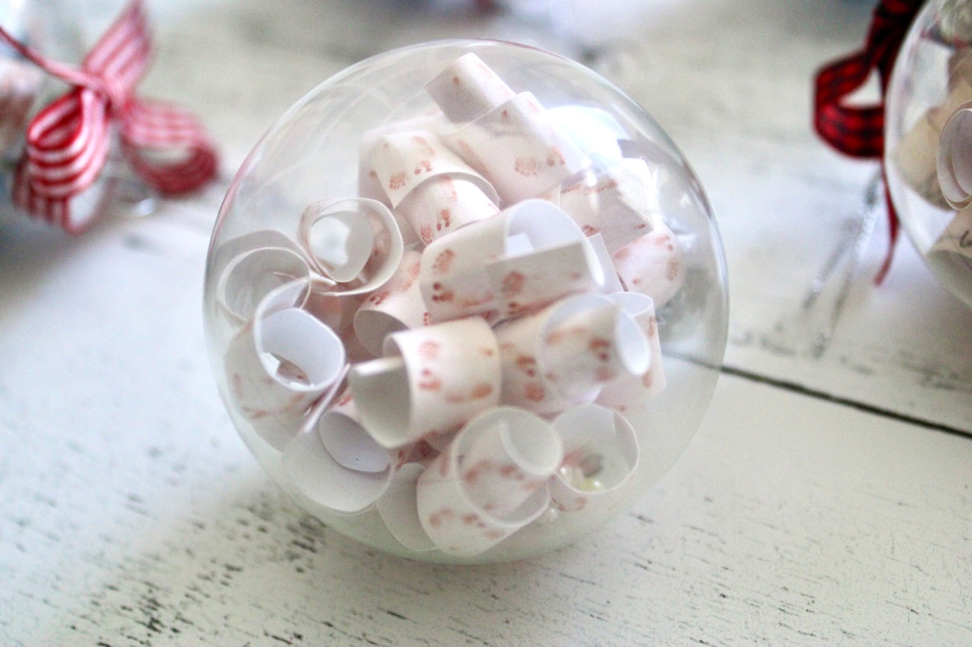 clear christmas ornament with paper inside