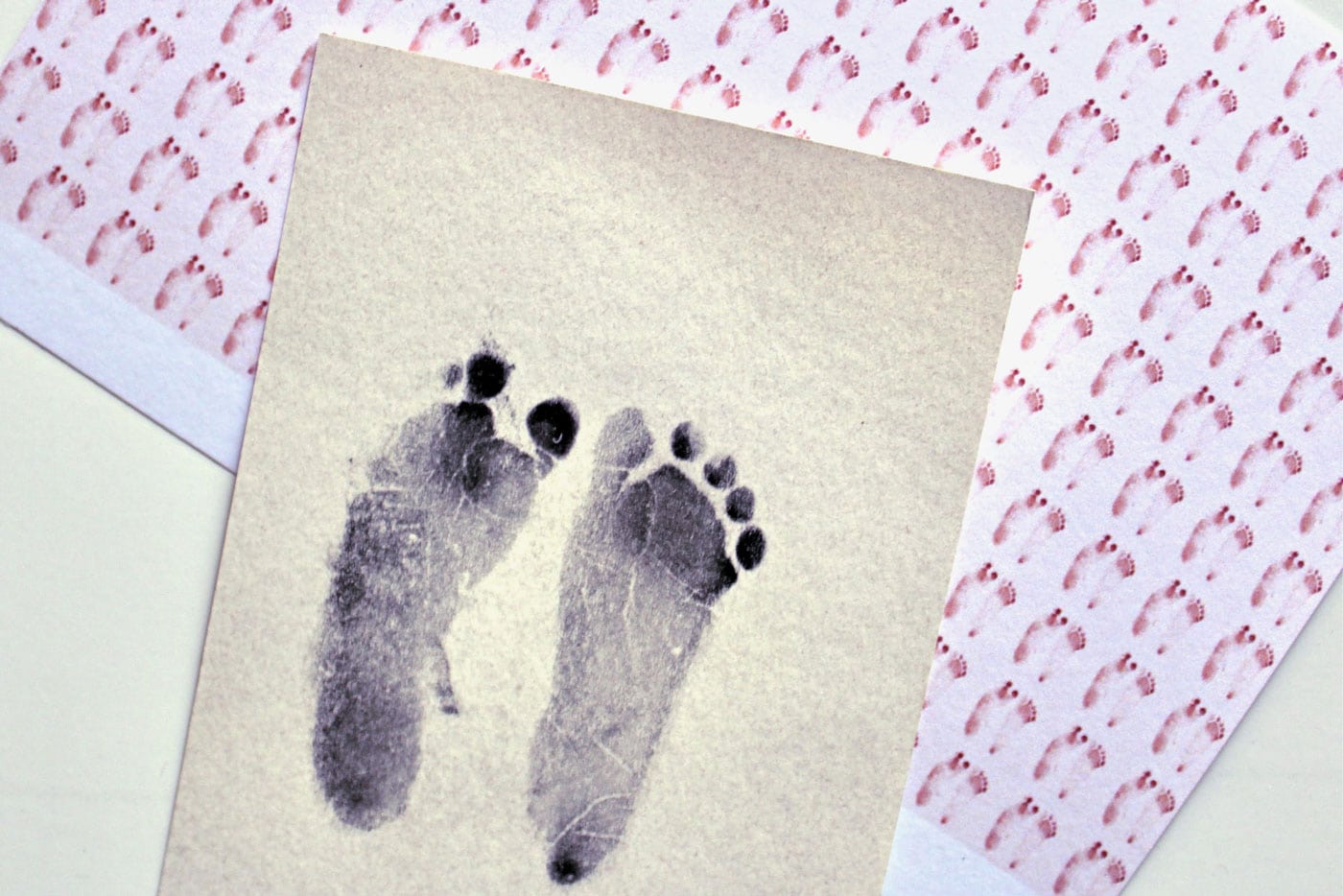 Image of baby foot prints and paper
