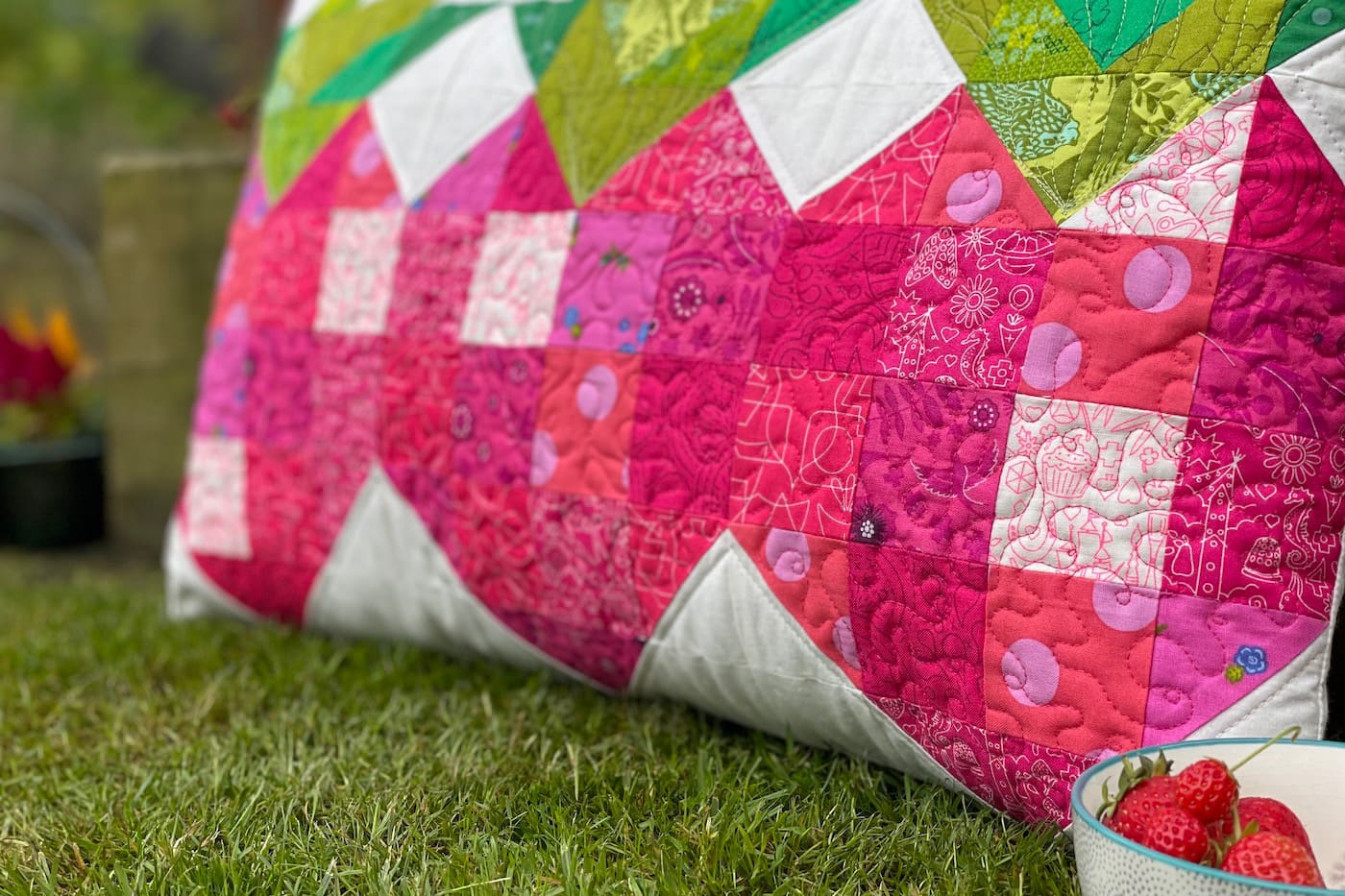 quilted strawberry patchwork pillow outdoors