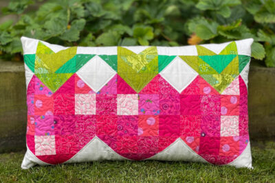 quilted strawberry patchwork pillow outdoors