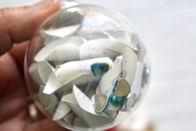 clear christmas ornament with paper inside