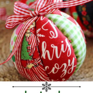 red, white and green fabric christmas ornament with bow in basket