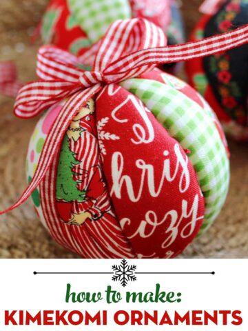 red, white and green fabric christmas ornament with bow in basket