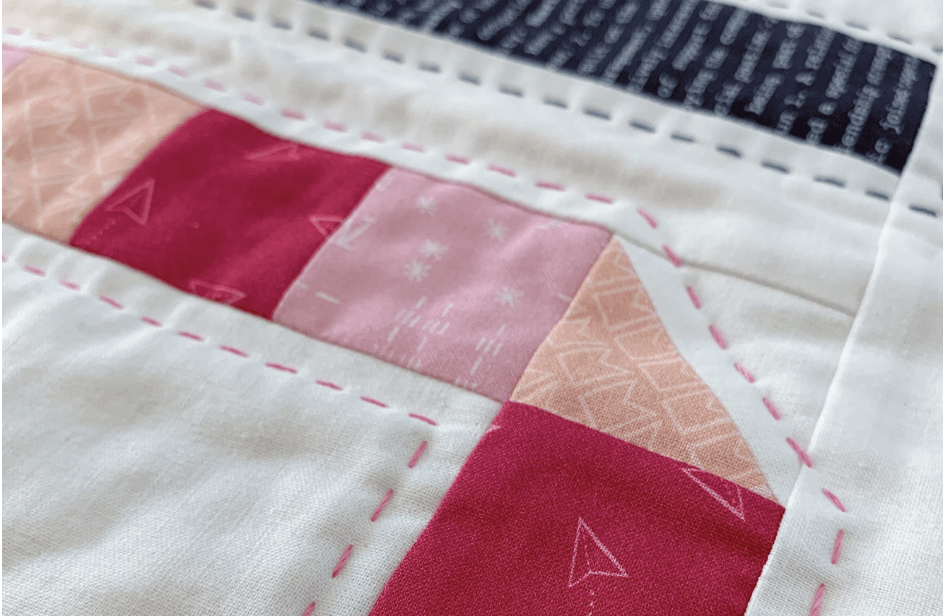 close up of hand quilting on fabric