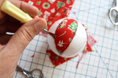 screw driver and foam ball with fabric on table