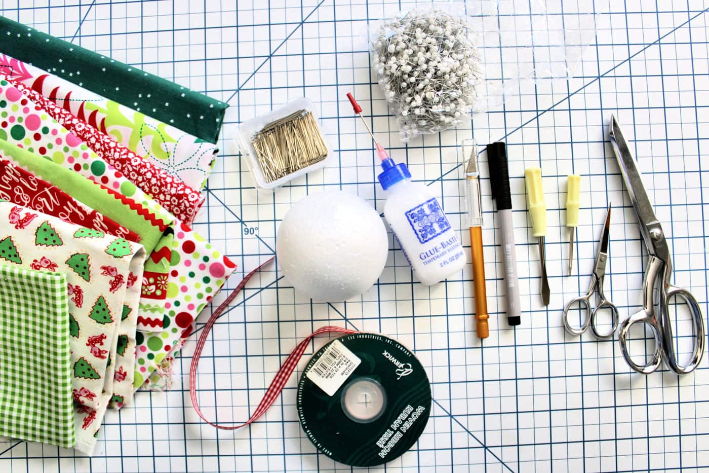 ornament supplies on white cutting mat