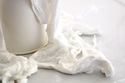 cheesecloth draped over cups
