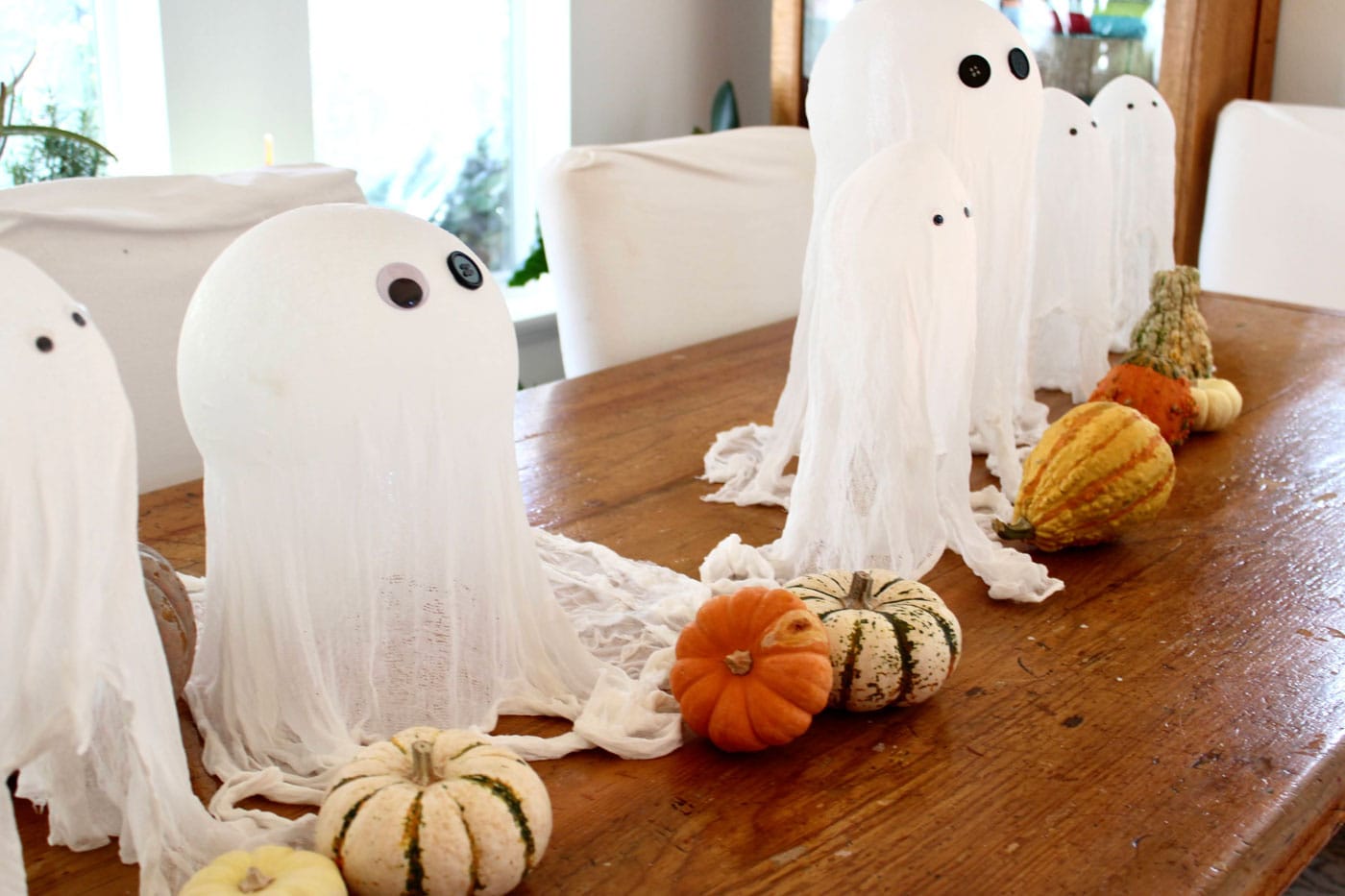 cheesecloth ghosts on table