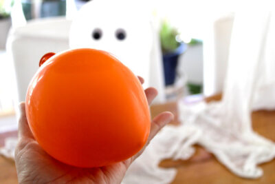 Orange balloon on table