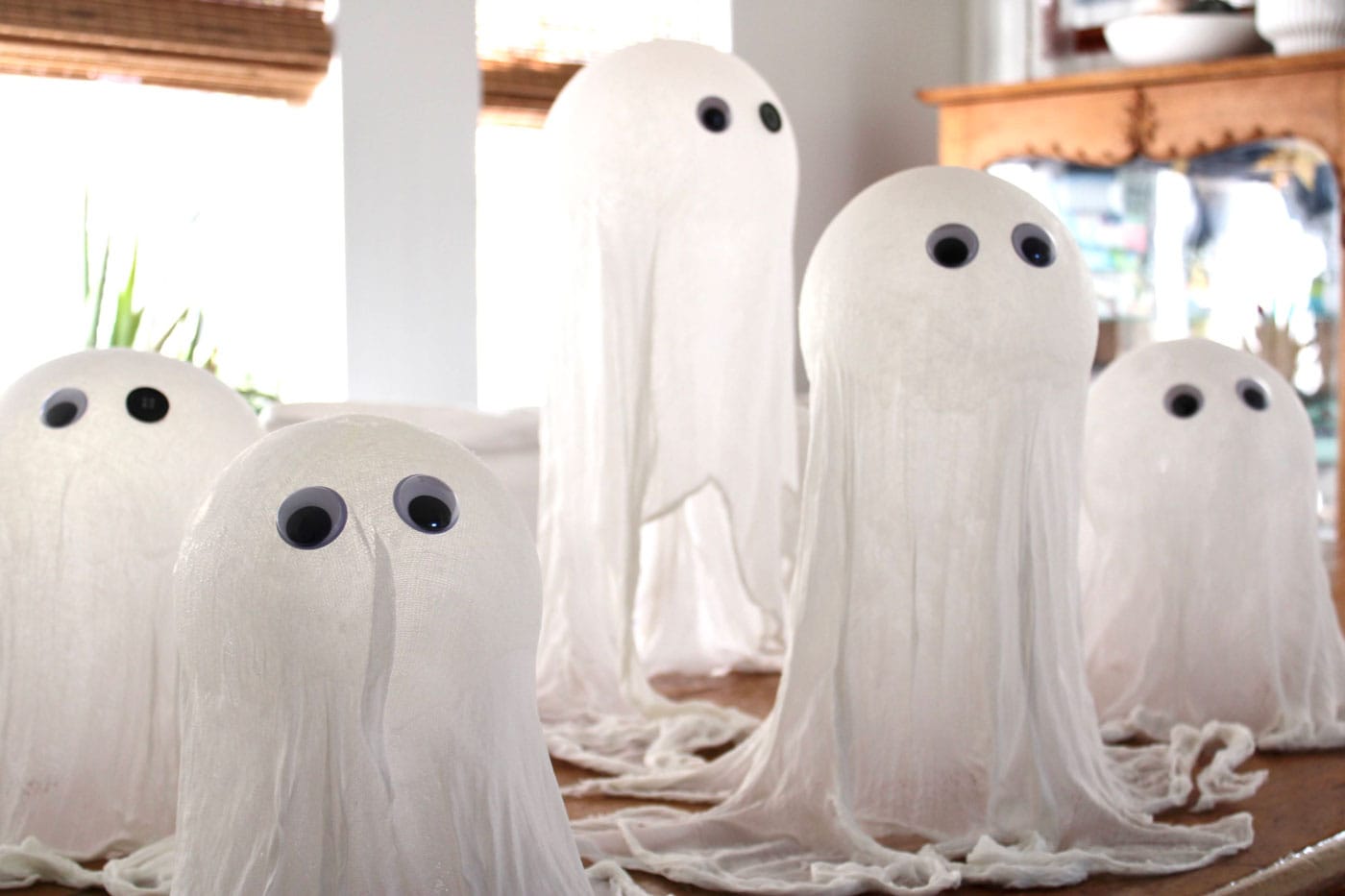 cheesecloth ghosts on table