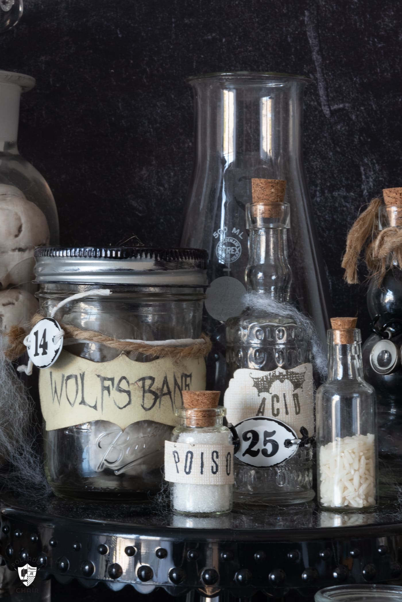 glass potions bottles on black table