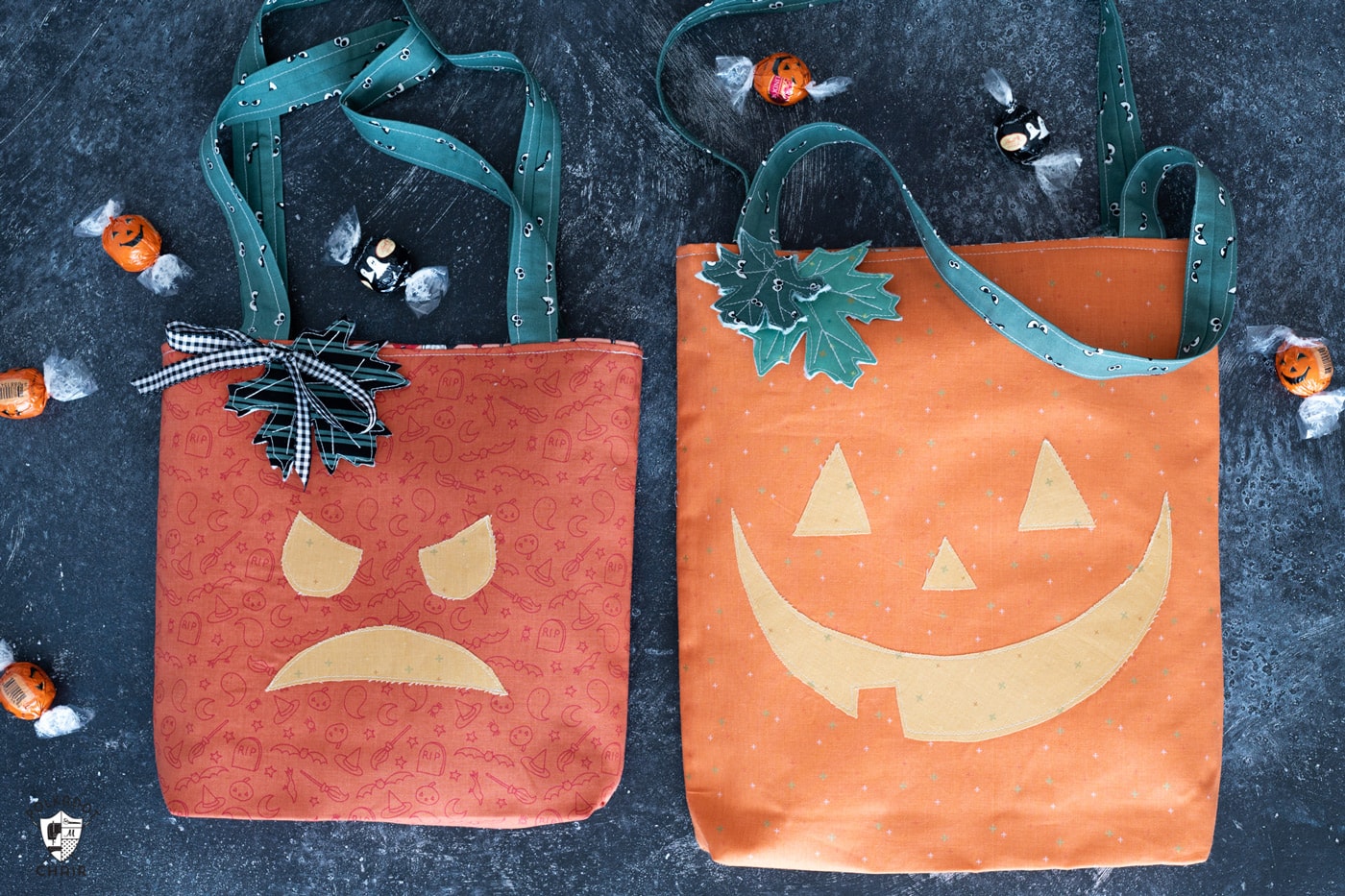 two trick or treat totes on black countertop