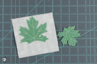 leaf shape, paper and fabric on cutting mat