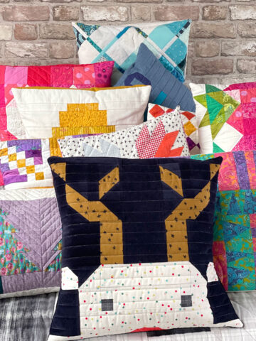 stack of colorful quilted pillows
