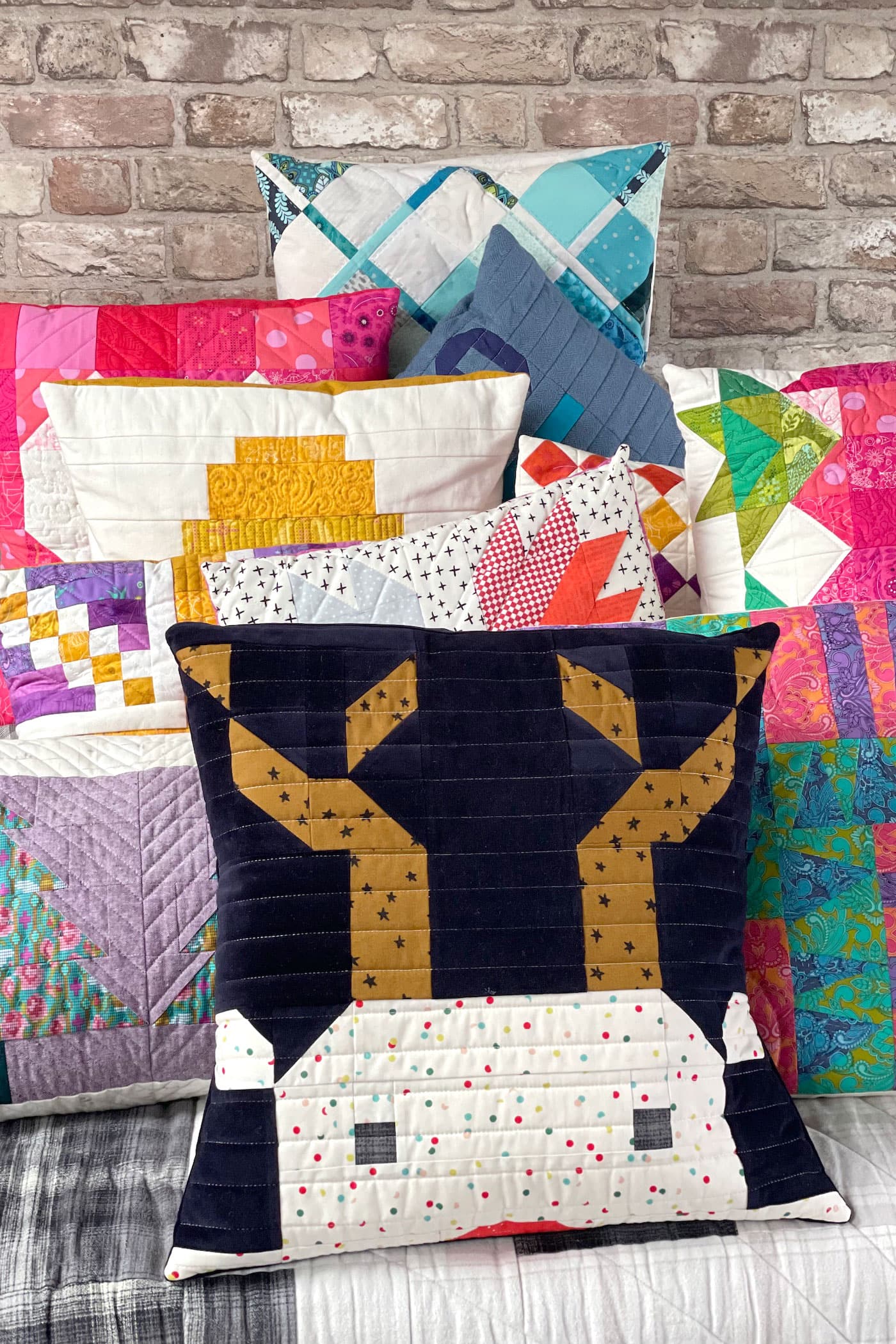 stack of colorful quilted pillows