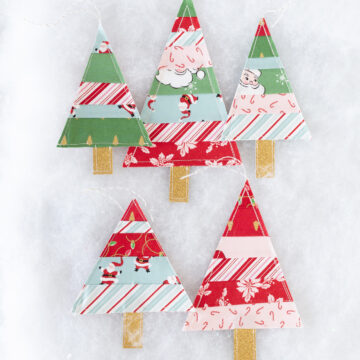 striped christmas tree ornaments on white table