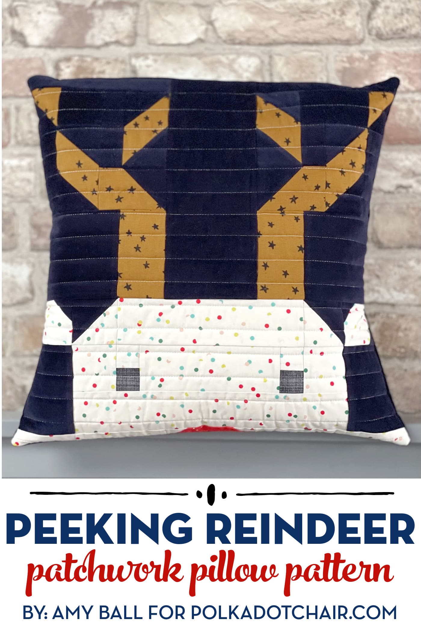 quilted reindeer pillow in front of brick wall